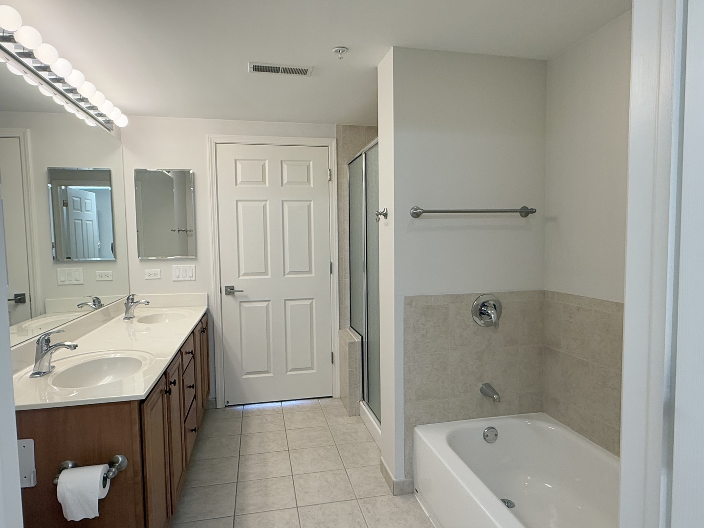 20 South Main Street, Unit 506 Mount Prospect, IL 60056 - Photo 17 of 22 a bathroom with a tub sink and mirror