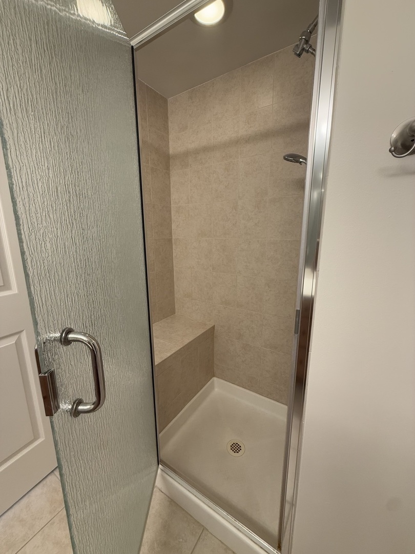 20 South Main Street, Unit 506 Mount Prospect, IL 60056 - Photo 19 of 22 a bathroom with a glass shower door