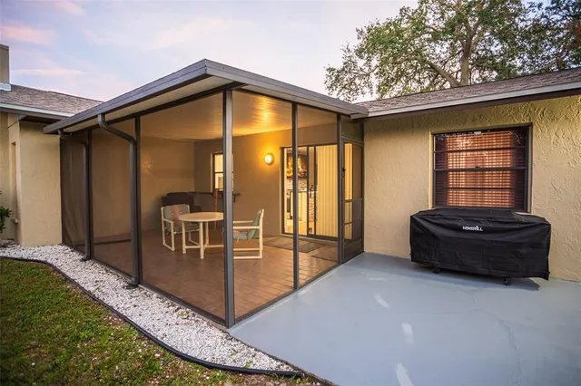 a backyard of a house with sofas