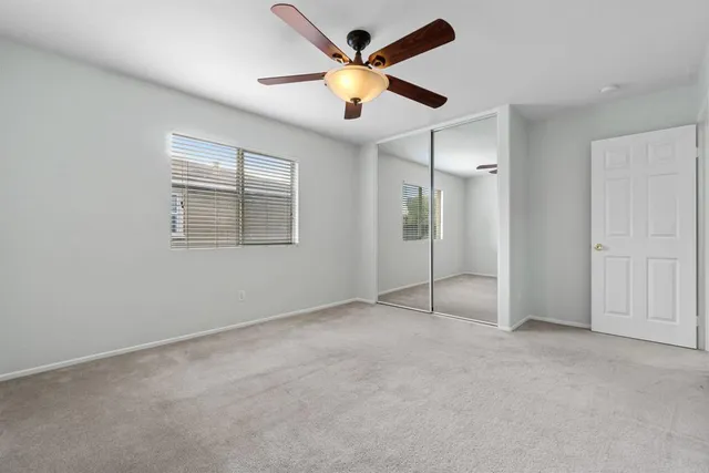a spacious bathroom with a glass door shower