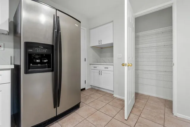 a bathroom with a toilet sink vanity and mirror