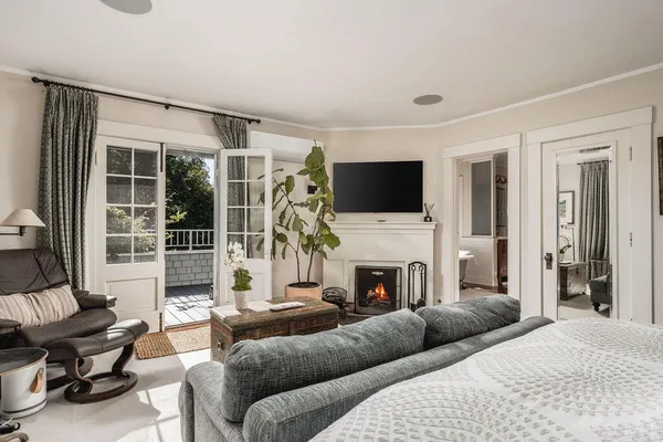 a bedroom with furniture and white walls
