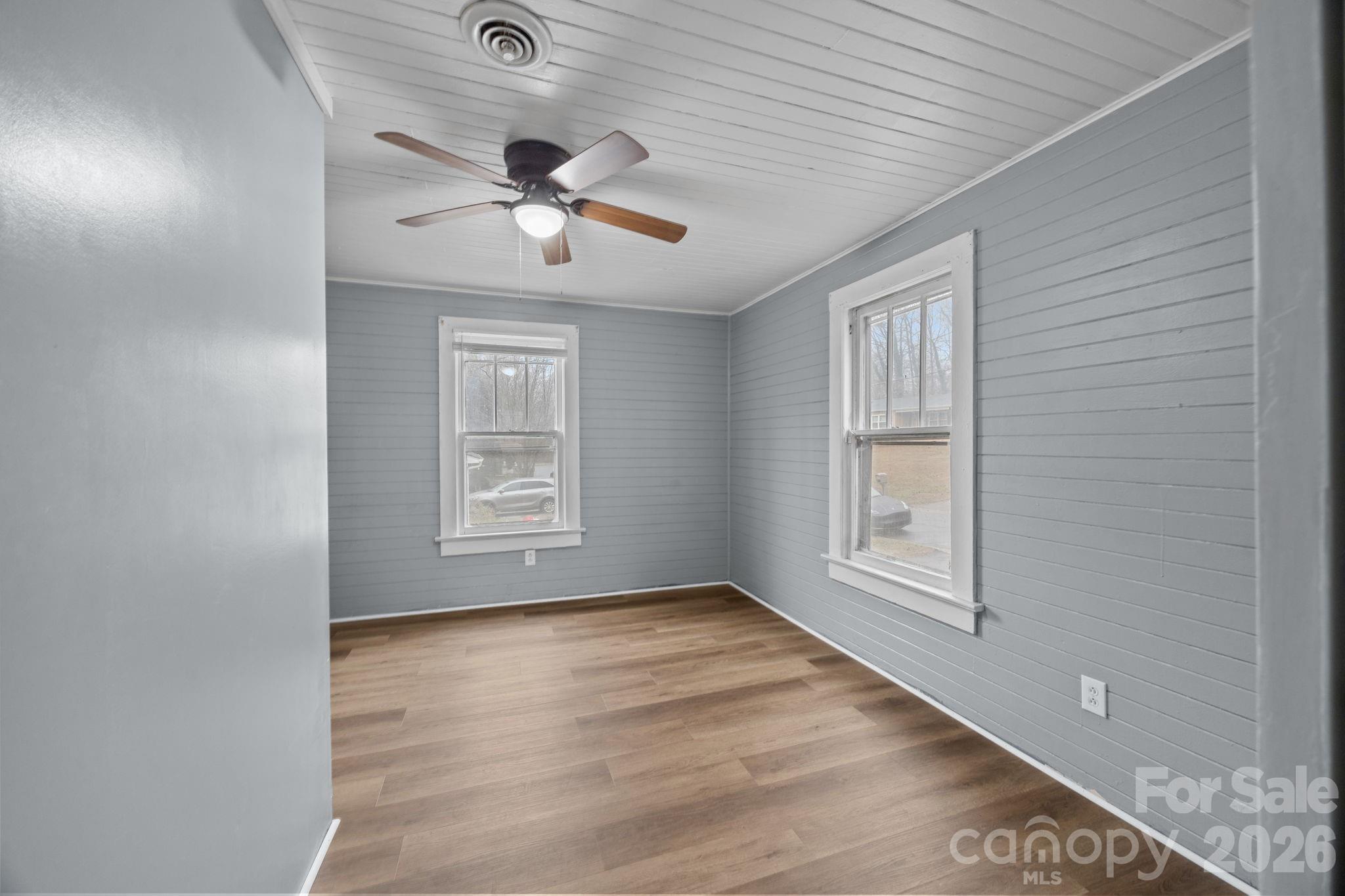 713 2nd St Place Southwest Conover, NC 28613 - Photo 11 of 31 wooden floor in an empty room with a window