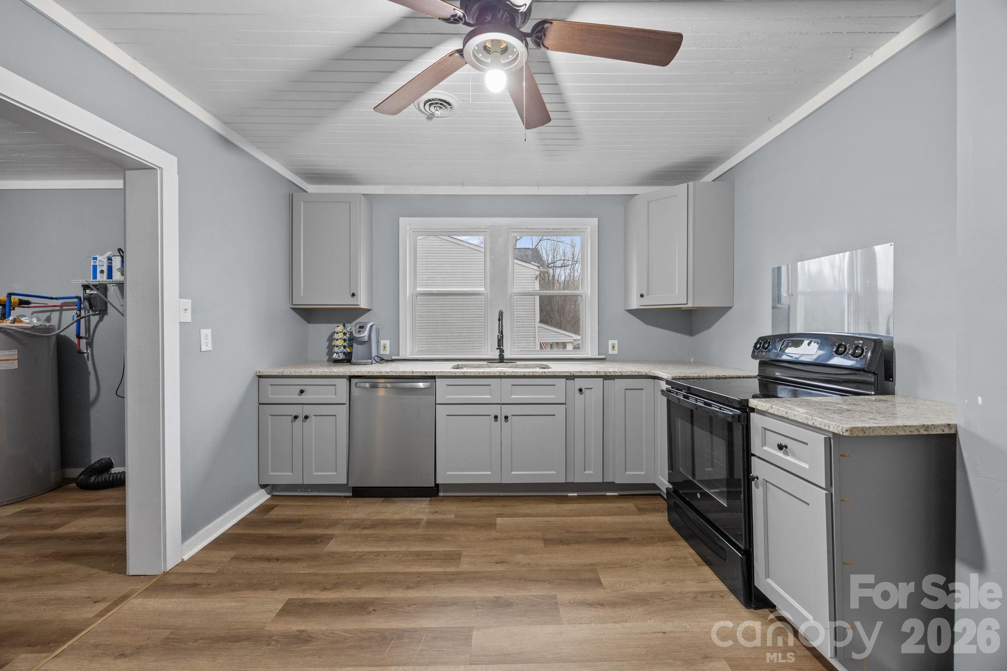 713 2nd St Place Southwest Conover, NC 28613 - Photo 17 of 31 a kitchen with a sink stove and refrigerator