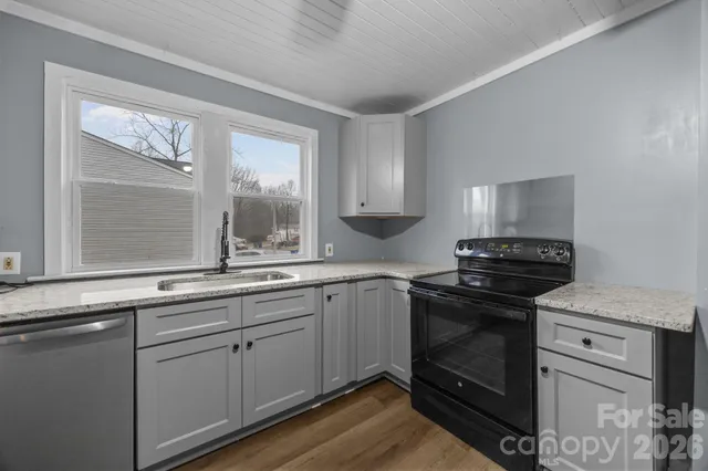 a sink with granite countertop a sink and cabinets