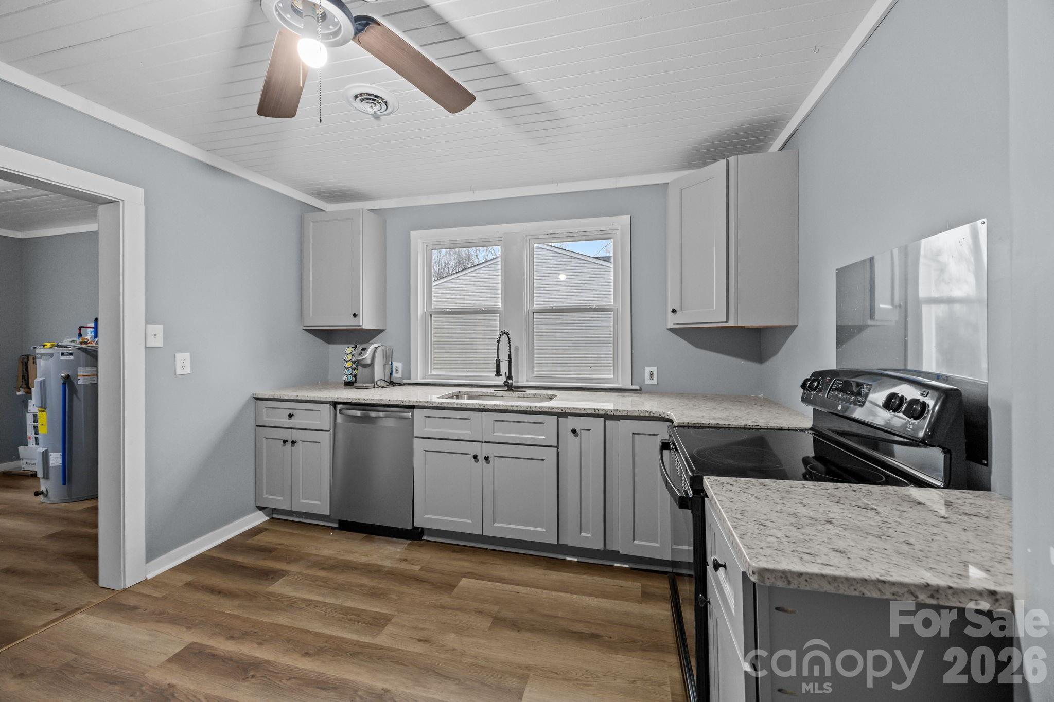 713 2nd St Place Southwest Conover, NC 28613 - Photo 23 of 31 a kitchen with stainless steel appliances granite countertop a stove sink and cabinets