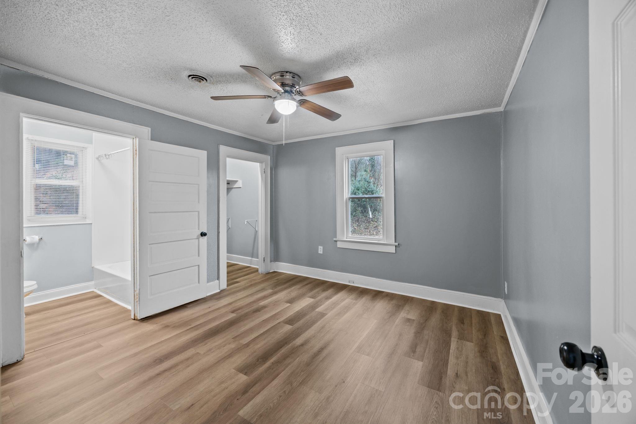 713 2nd St Place Southwest Conover, NC 28613 - Photo 26 of 31 a view of an empty room with wooden floor and a window
