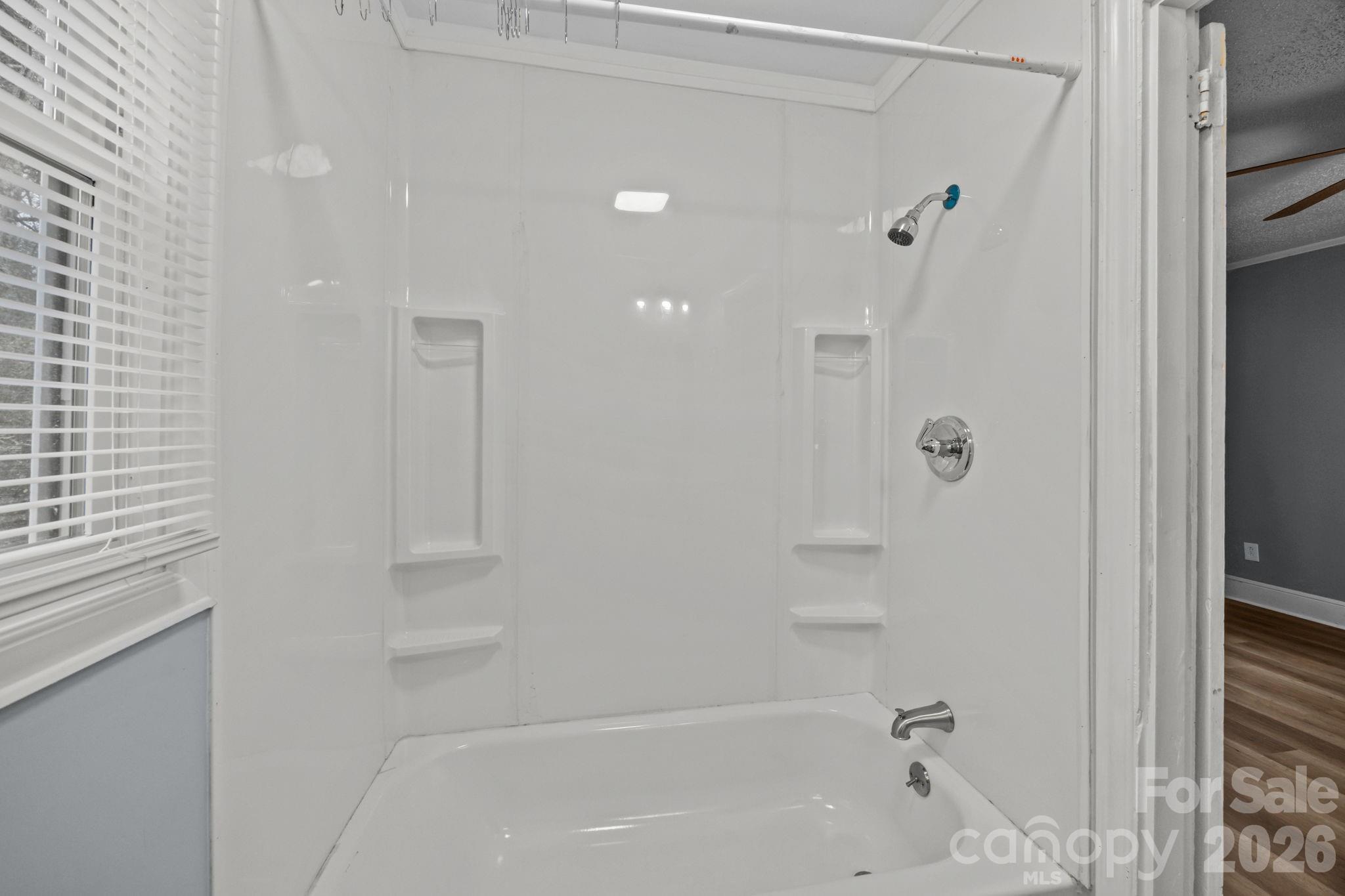 713 2nd St Place Southwest Conover, NC 28613 - Photo 30 of 31 a bathroom with a bathtub and a shower