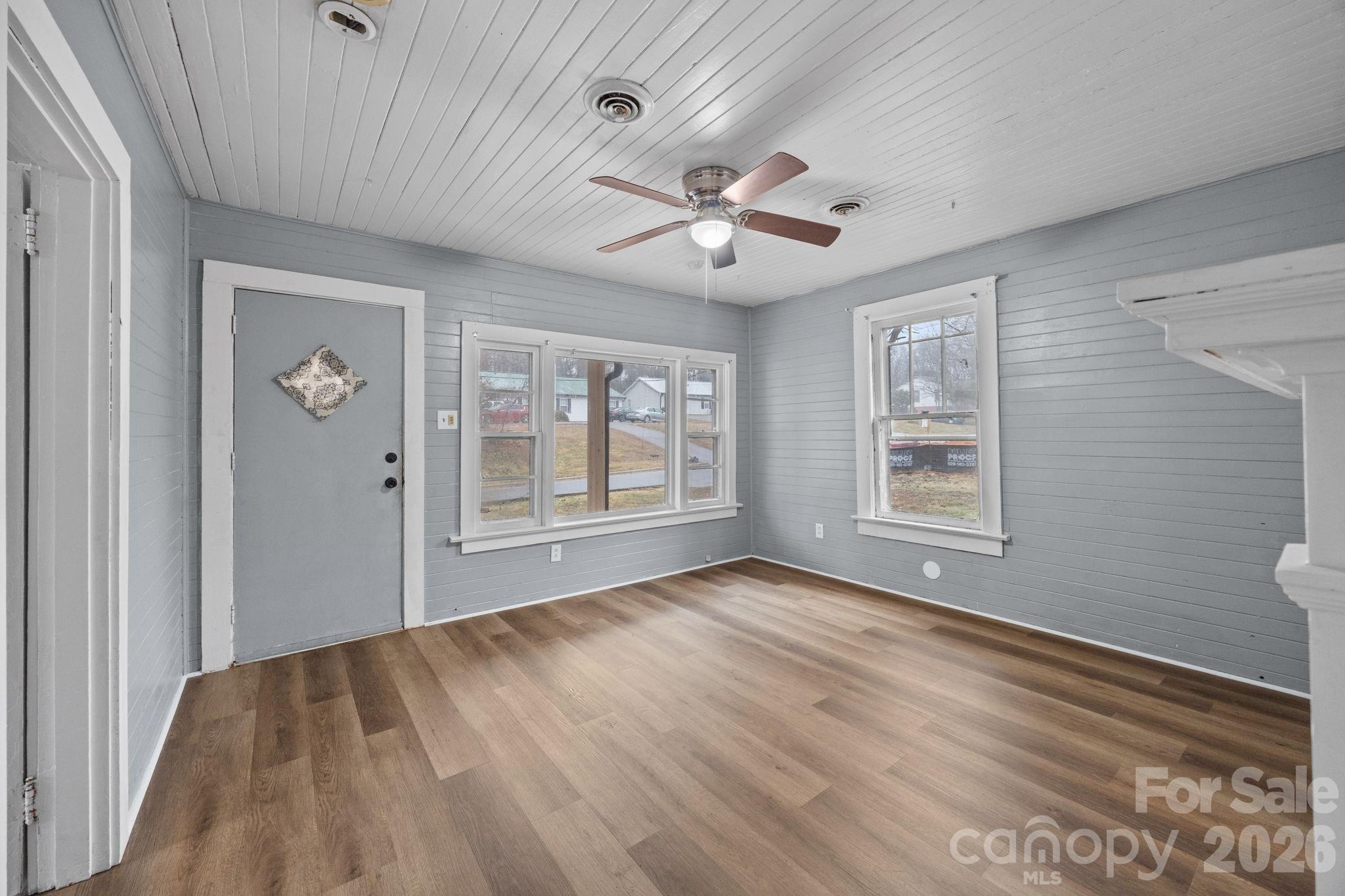 713 2nd St Place Southwest Conover, NC 28613 - Photo 10 of 31 a view of an empty room with a window and wooden floor