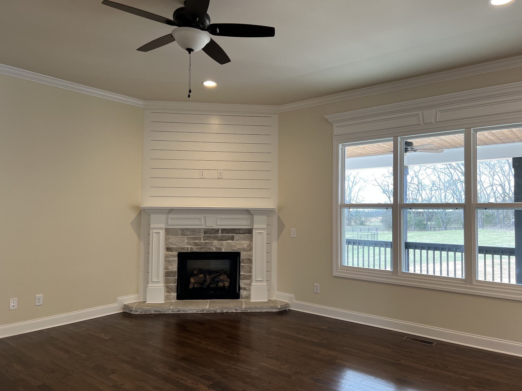 1067 Hideaway Road Columbia, TN 38401 - Photo 4 of 7 a view of an empty room with wooden floor and a fireplace