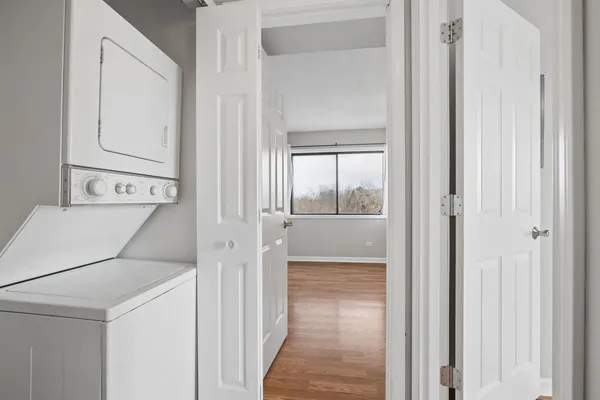 a view of a hallway with washer and dryer