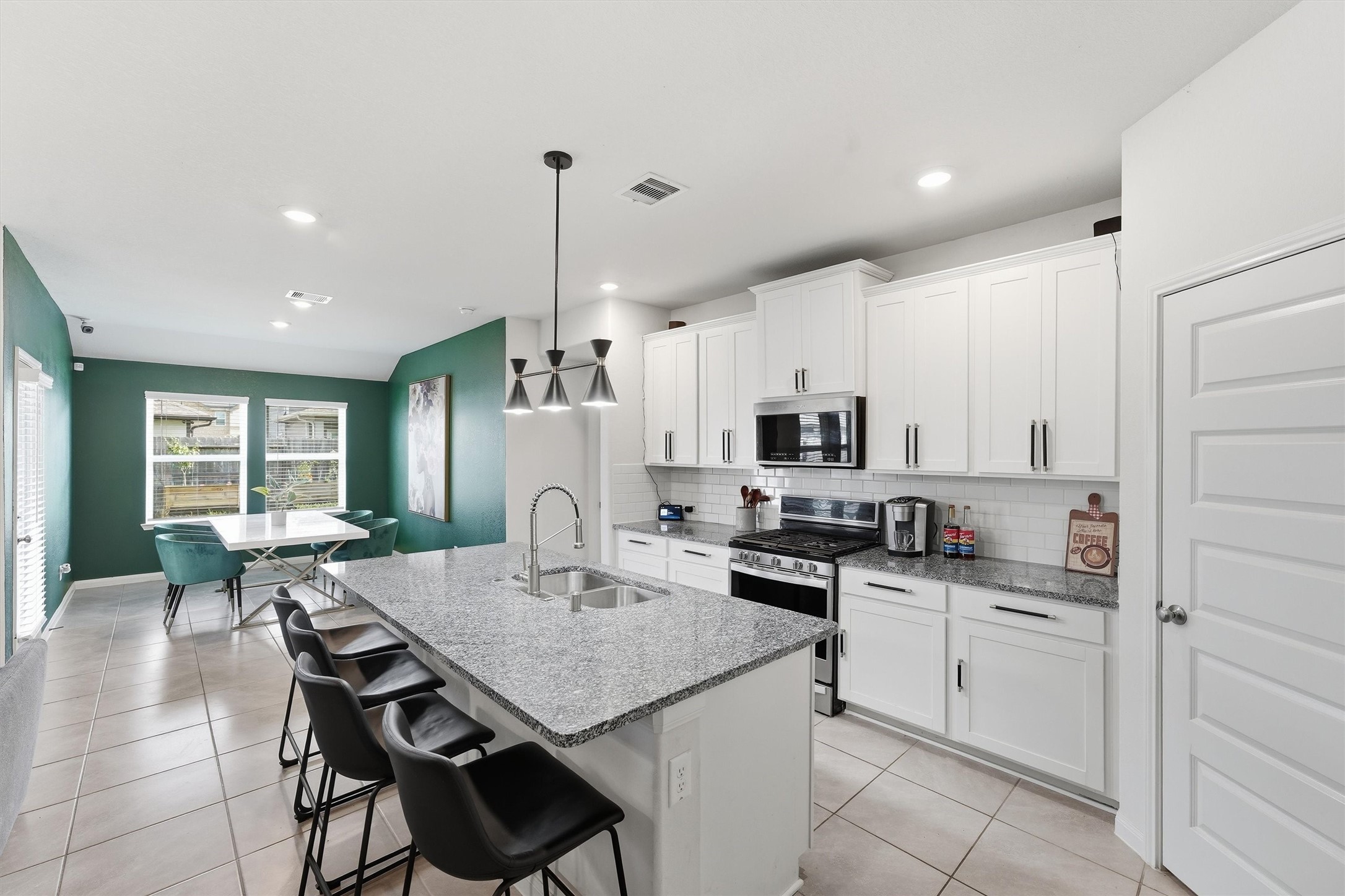 1007 Modesto Drive Rosharon, TX 77583 - Photo 8 of 25 Open kitchen and dining spaces make everyday meals and entertaining effortless.