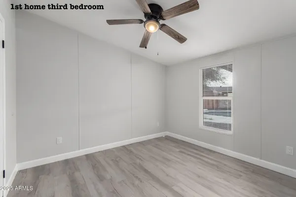 a bathroom with a granite countertop sink toilet a mirror and shower