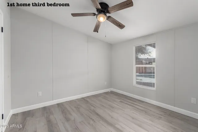 a bathroom with a granite countertop sink toilet a mirror and shower