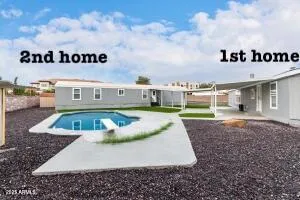 a view of pool with a yard