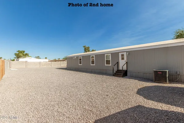 a spacious bathroom with a double vanity sink a mirror and a shower