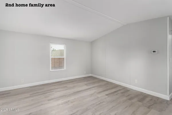 a bathroom with a sink a vanity and shower