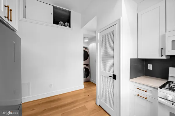 a view of a kitchen with storage and utility