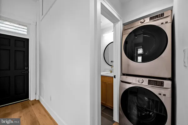 a view of a hallway with washer and dryer