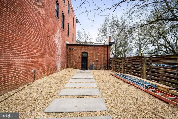 a view of a backyard of the house