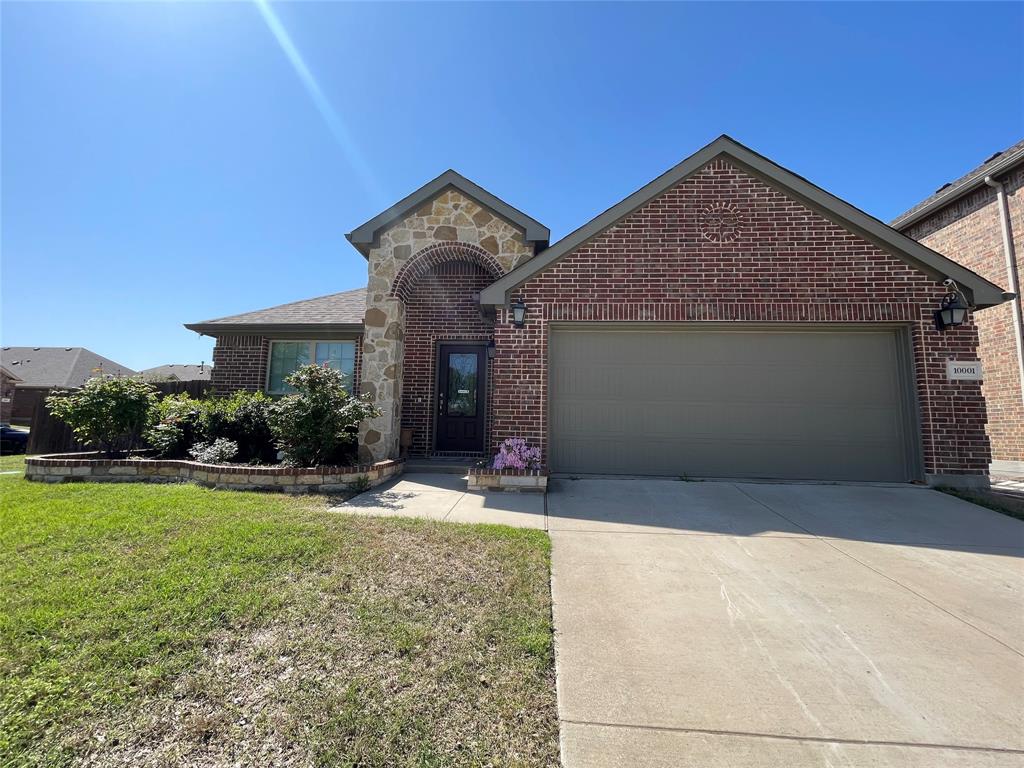 10001 Long Branch Drive McKinney, TX 75071 - Photo 1 of 24 a front view of a house with garden