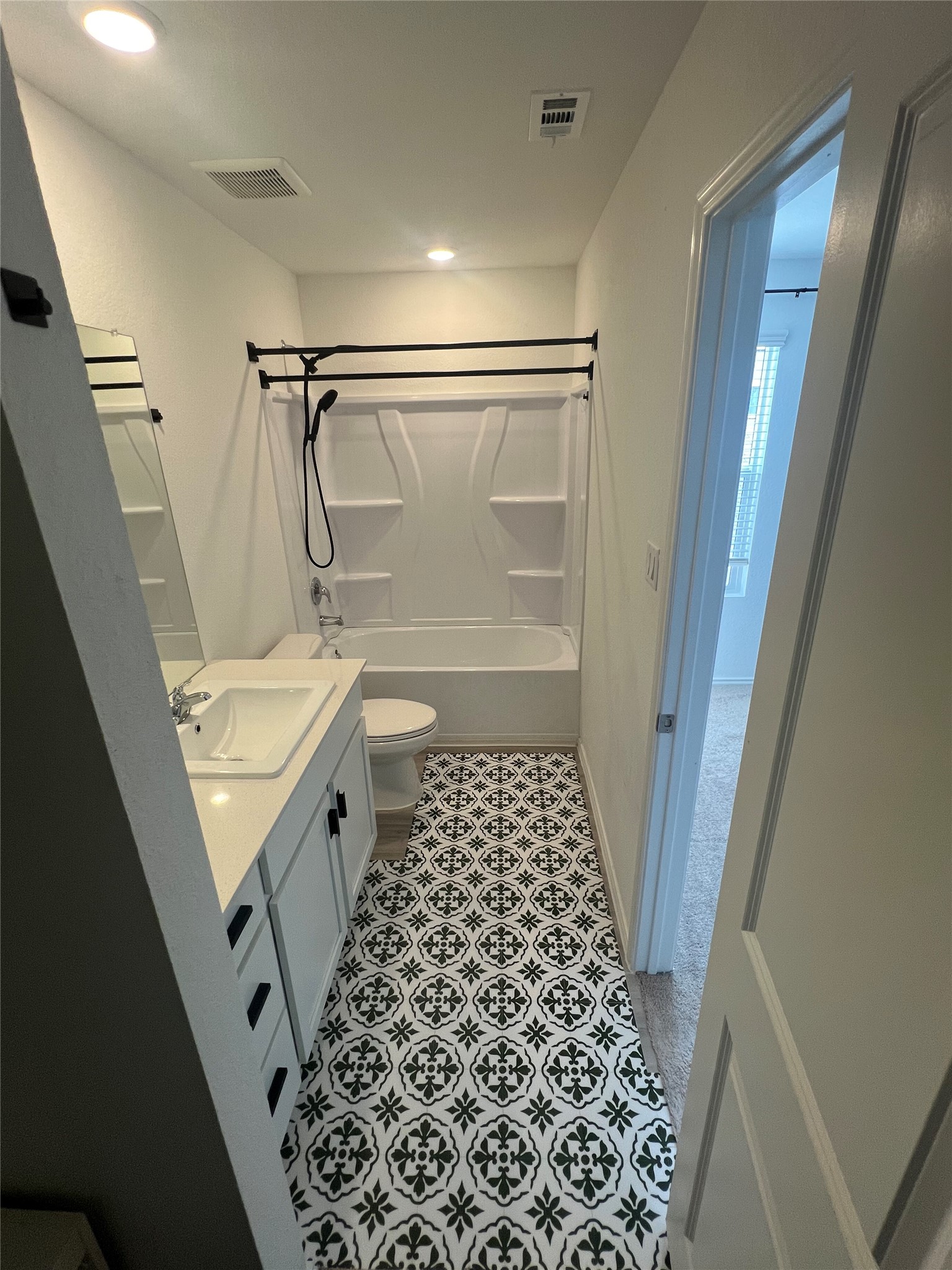 520 Commander Abbott Drive Jarrell, TX 76537 - Photo 12 of 25 a bathroom with a bathtub and a shower