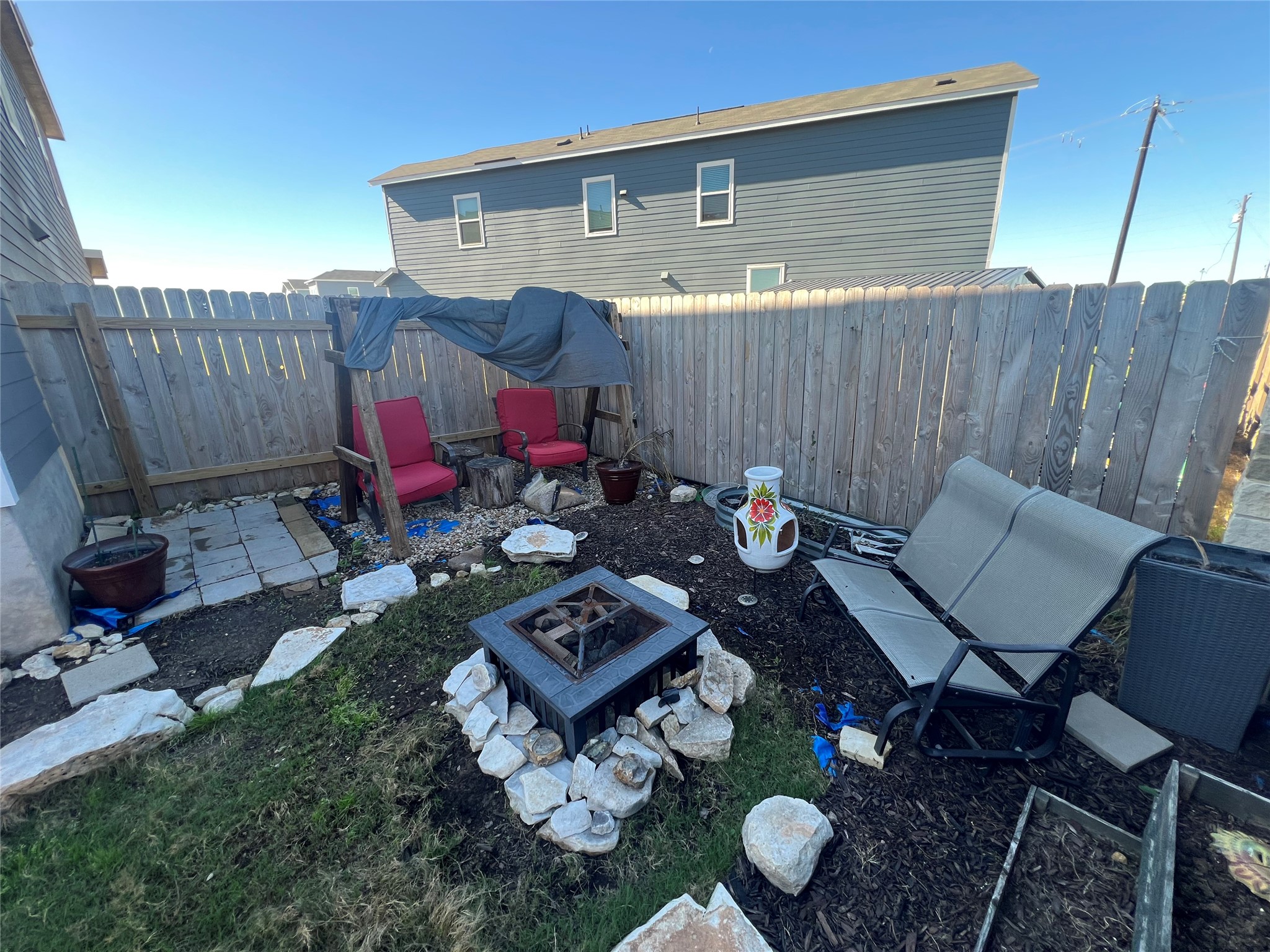 520 Commander Abbott Drive Jarrell, TX 76537 - Photo 21 of 25 a backyard of a house with table and chairs