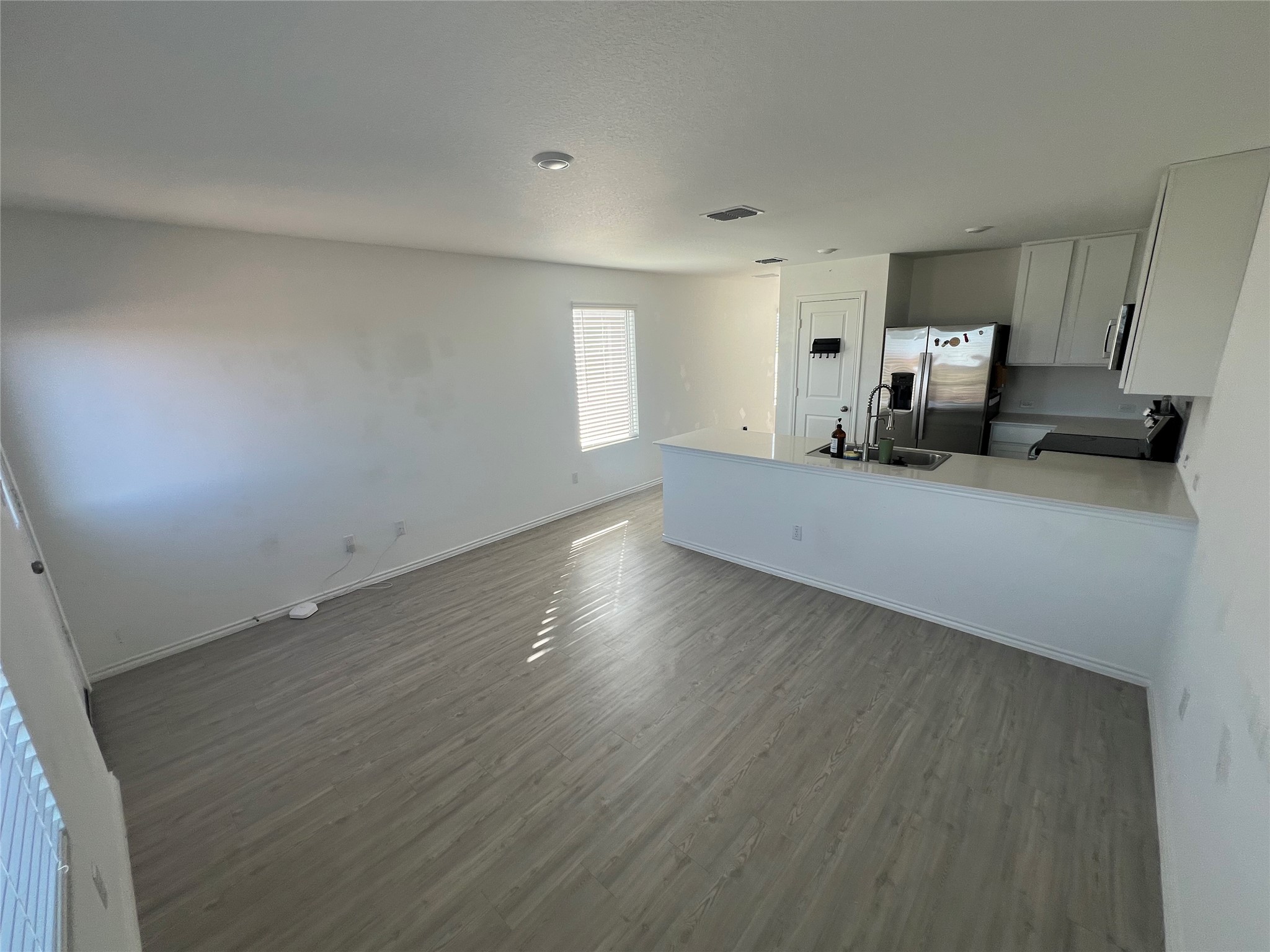 520 Commander Abbott Drive Jarrell, TX 76537 - Photo 8 of 25 a view of a furniture and wooden floor in a room