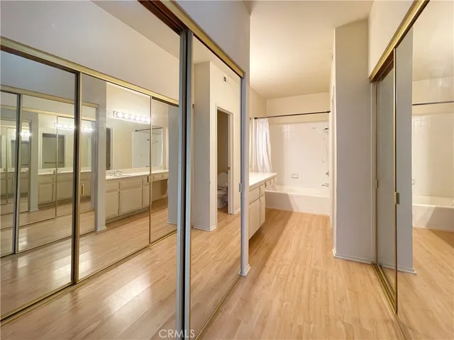 a bathroom with a glass shower door