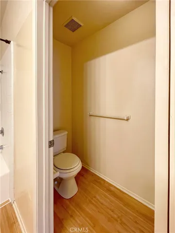 a white toilet sitting next to a bathroom sink