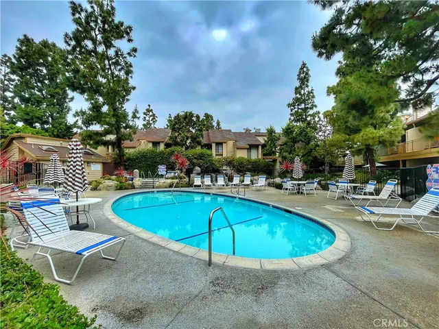 a view of a swimming pool with chairs