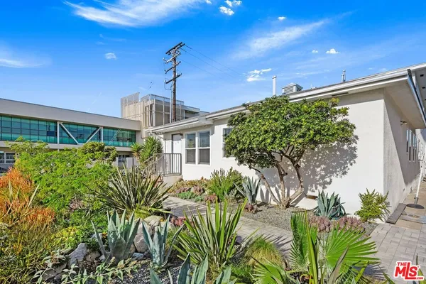 a view of balcony with wooden floor and fence