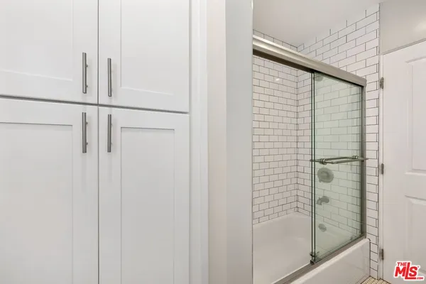 a bathroom with a sink and shower