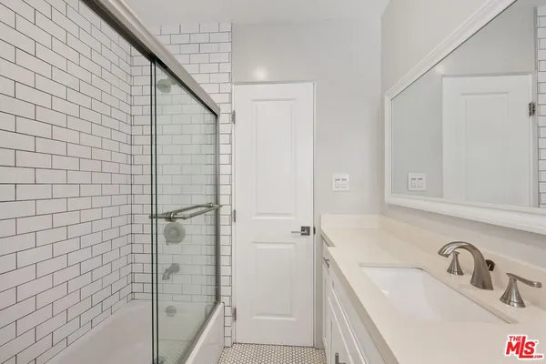 a view of a bathroom from the hallway