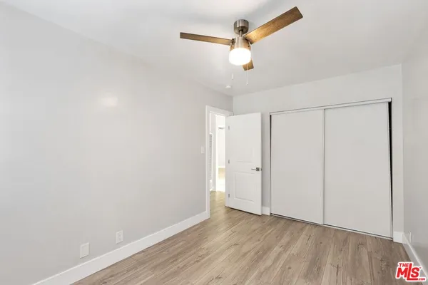 a view of a chairs and table in patio