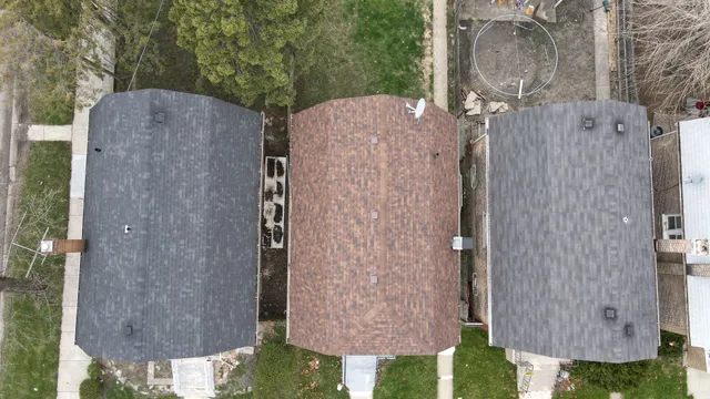 an aerial view of a house with an outdoor space