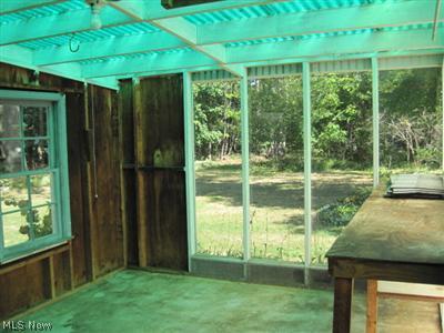 1129 Croyden Road Lyndhurst, OH 44124 - Photo 23 of 25 Greenhouse/potting shed has windows with views of the beautiful treed back yard.