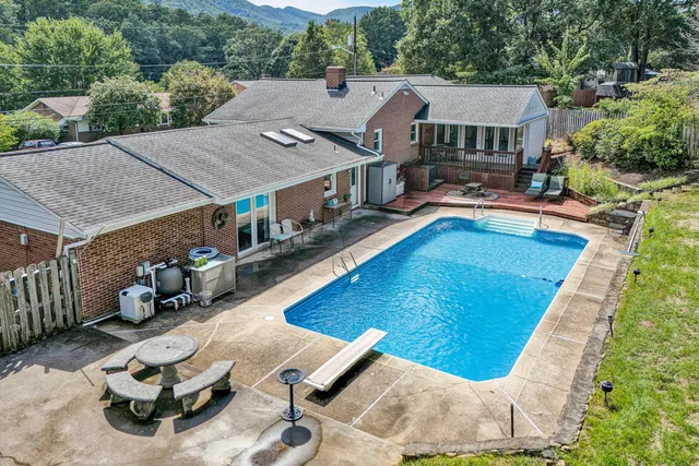 a aerial view of a house with swimming pool and porch