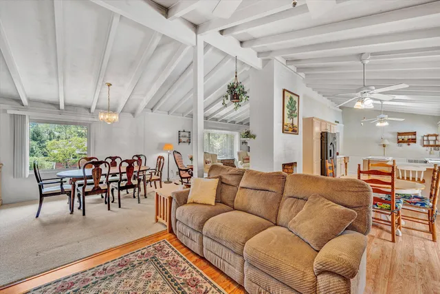 a kitchen with stainless steel appliances granite countertop a sink a stove and a refrigerator