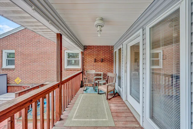 an outdoor sitting area with couch and trees