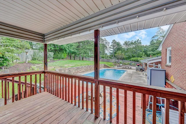 a aerial view of a house with swimming pool and porch
