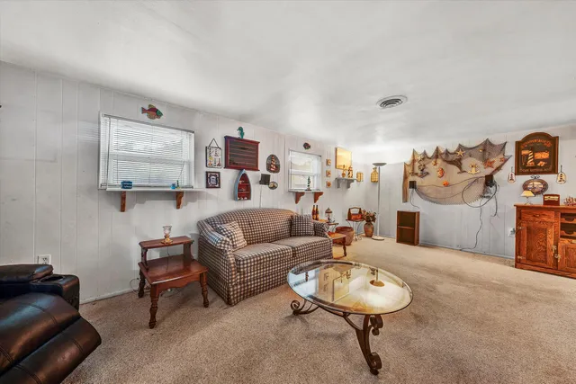 an aerial view of house with swimming pool outdoor seating and yard