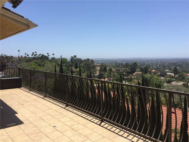 a view of balcony with wooden floor