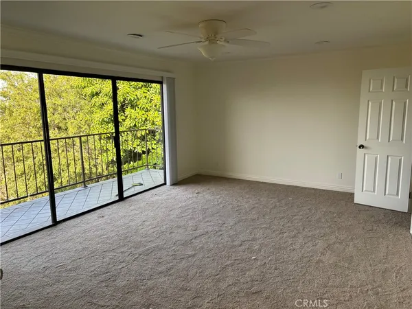 a view of a big room with windows