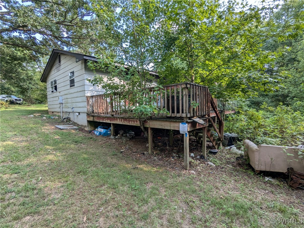 3961 Old Buckingham Road Powhatan, VA 23139 - Photo 5 of 7 a wooden bench sitting in backside of a house
