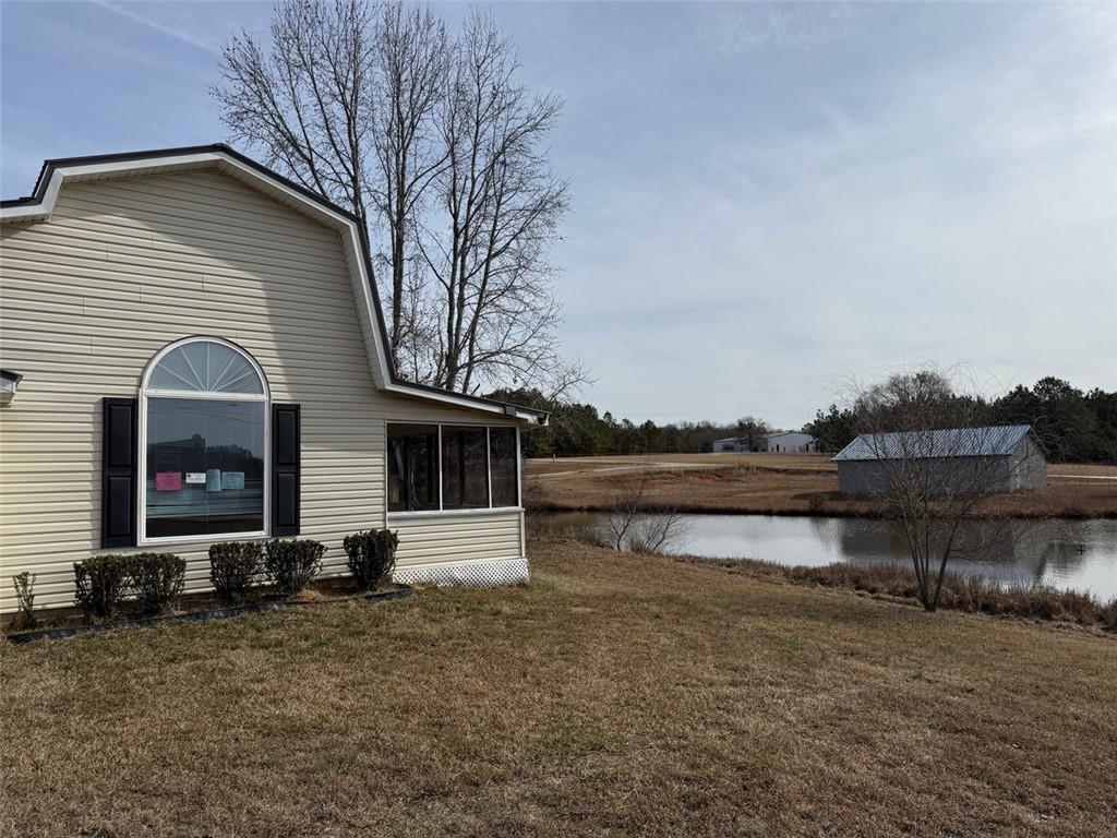 149 Woody Road Jackson, GA 30233 - Photo 3 of 17 a front view of a house with lake