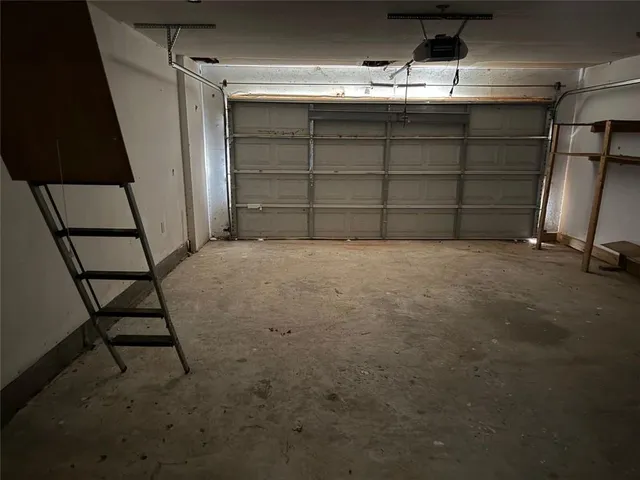 a view of empty room with wooden walls