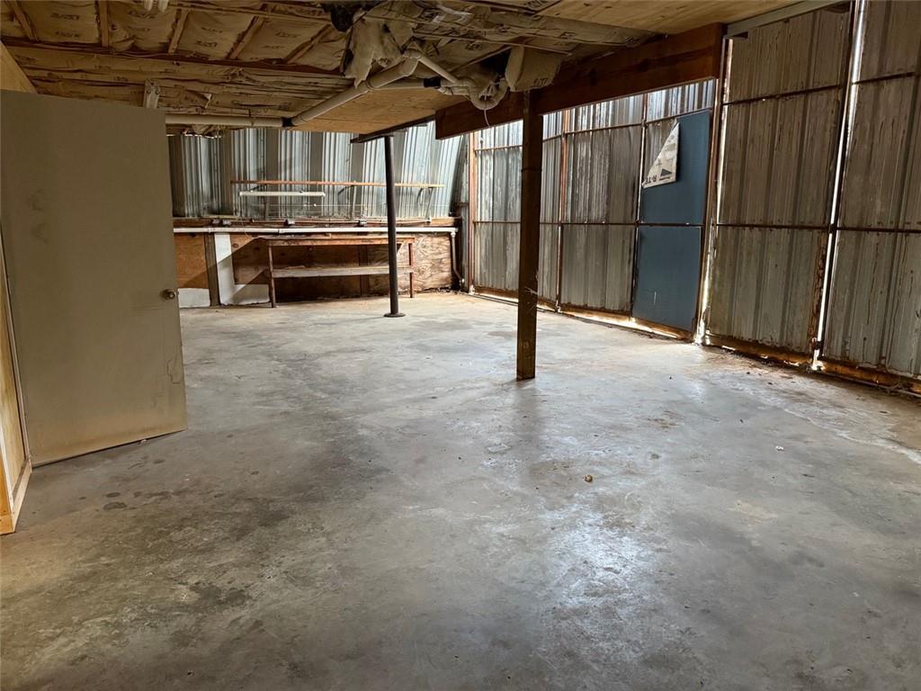 149 Woody Road Jackson, GA 30233 - Photo 9 of 17 a view of empty room with wooden walls