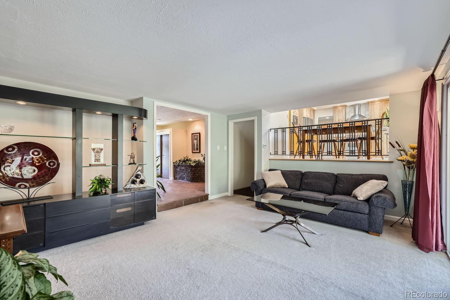6227 Colorow Drive Morrison, CO 80465 - Photo 11 of 43 a living room with furniture and a wooden floor