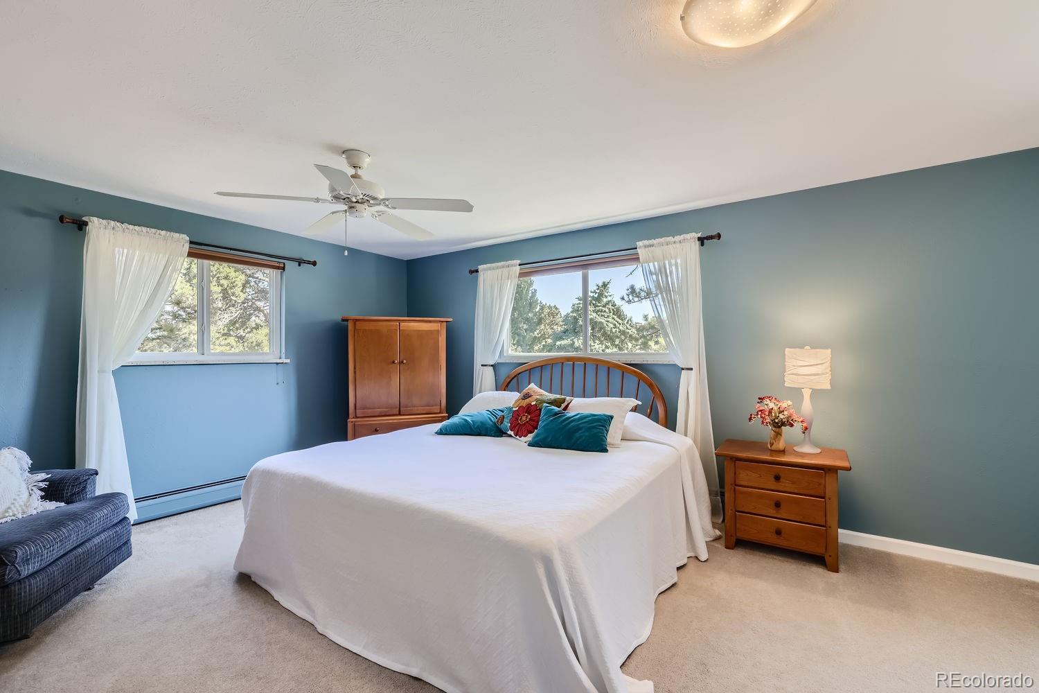 6227 Colorow Drive Morrison, CO 80465 - Photo 12 of 43 a bedroom with a bed and a window